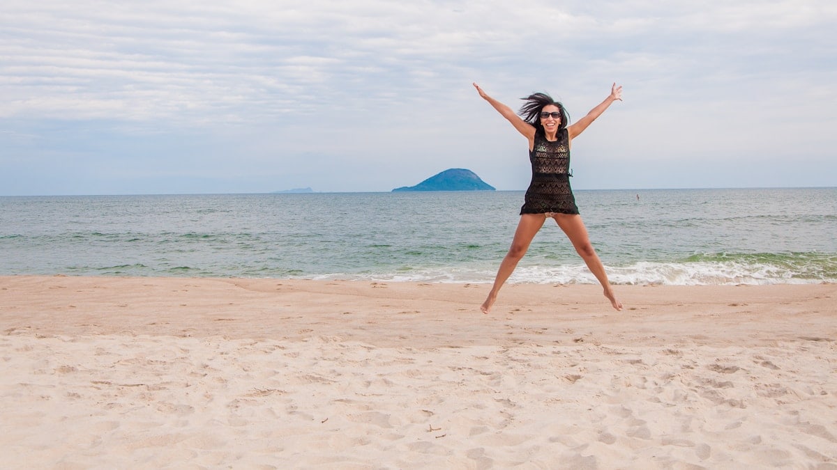 Woman jumping at beach